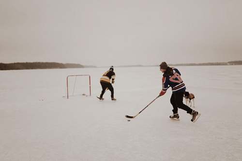 person people playing ice hockey hockey