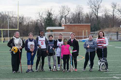 person people standing on american football field people