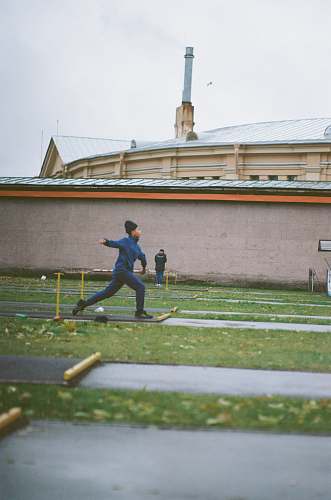 person person running on road near green field during daytime sport