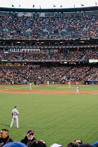 crowd photo of baseball players in stadium during daytime baseball