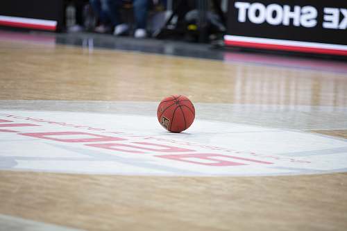 person red basketball on basketball court people