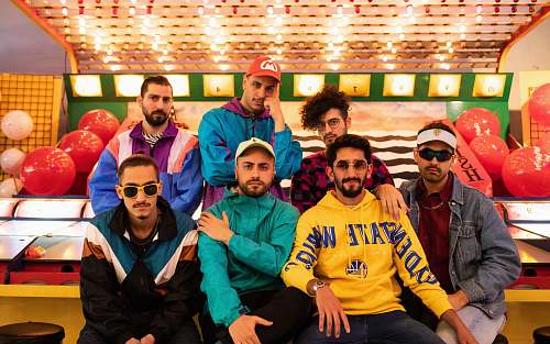 person seven men sitting on chair people