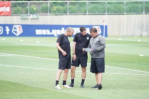 person three men standing on football field people