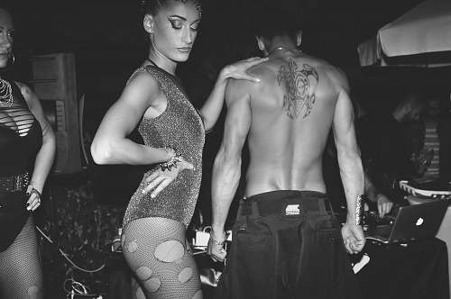 black-and-white topless man beside woman posing on stage skin