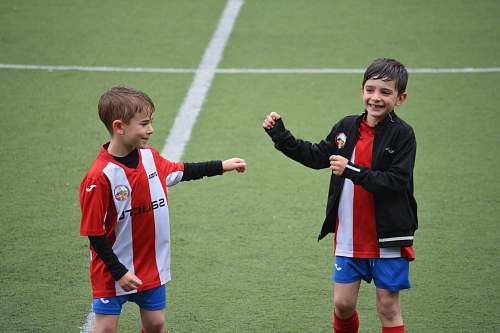 person two boys in soccer field people