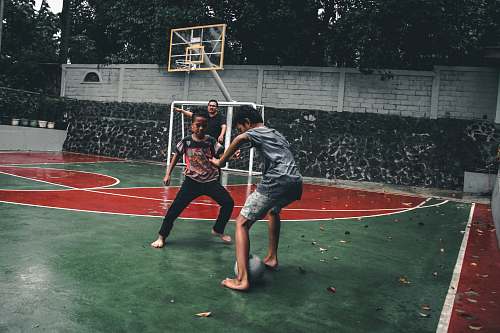 person two boys playing tiger football apparel