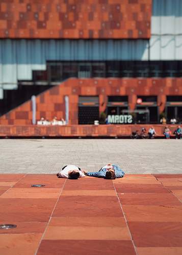 person two persons lying on ground antwerpen
