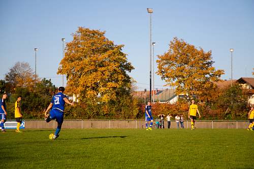 person unknown person playing soccer people