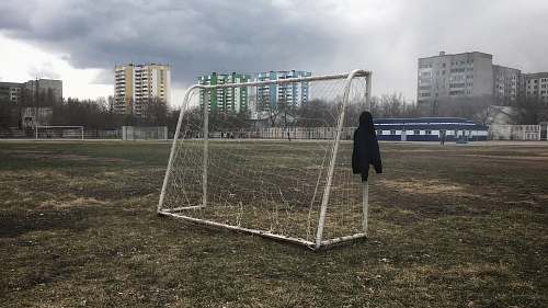 person white soccer net in field people