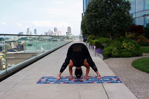 person woman doing yoga people