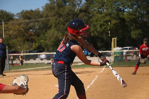 sport woman holding baseball bat on ballpark baseball