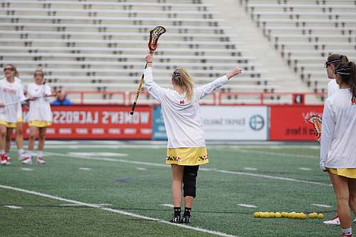 people woman holding lacrosse stick person