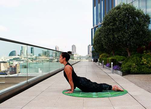 person woman lying on mat tree