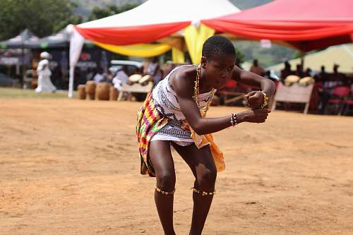 person woman performing dance surrounded by people people