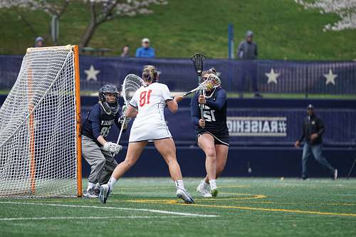 person woman playing lacrosse apparel