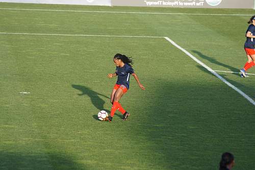 person woman playing soccer at daytime people