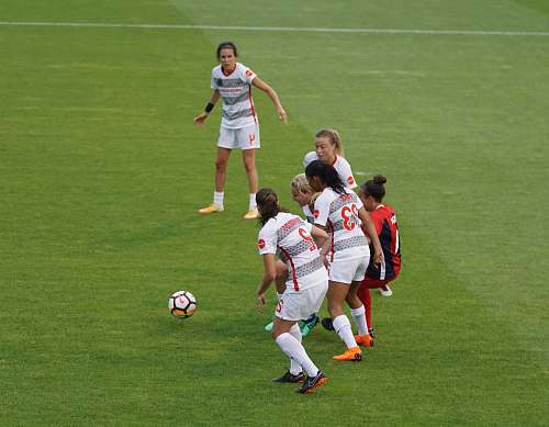 people woman playing soccer football