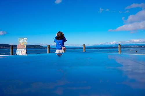 person woman standing beside sea people