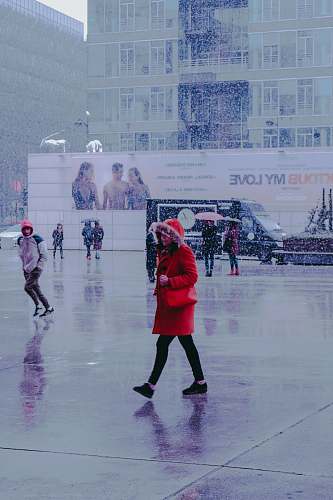 person woman wearing red coat skating