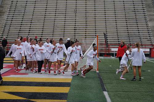 person women athletes playing on field people