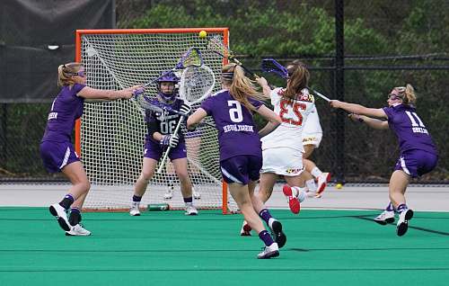 sport women playing lacrosse team
