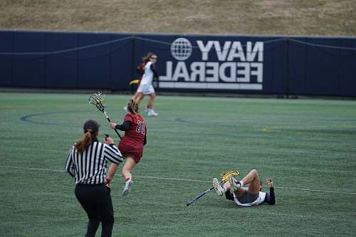person women playing lacrosse sports hockey