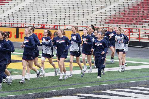 person women running on field at daytime people