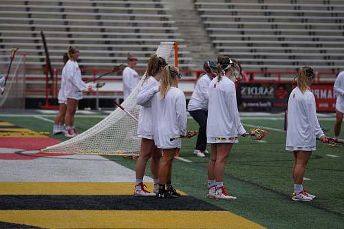 person women standing on sports field field