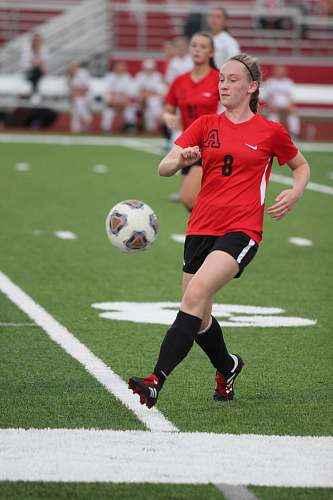 person women's black and red jersey shirt soccer