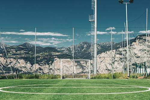 sports soccer field in distant of mountain football