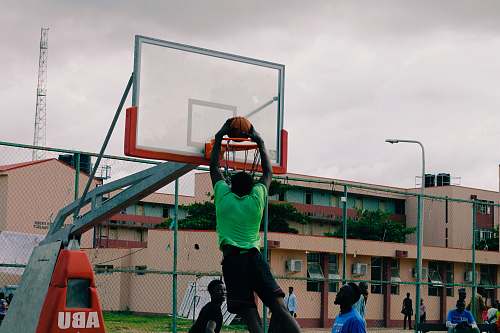 human man dunking the basketball person