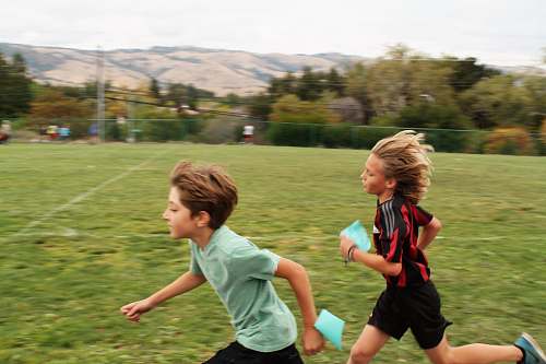 human boys running on field people