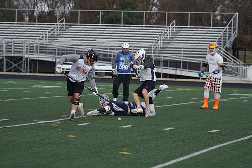 human four men playing field hockey apparel