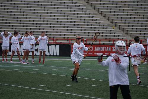 human group of people playing lacrosse game apparel