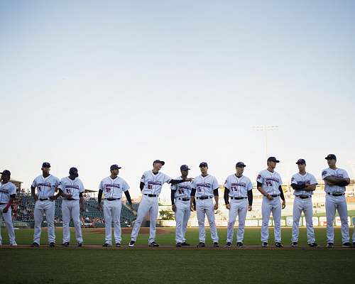 human lined baseball players on field people