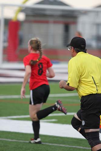 human man and woman running on field during daytime sport