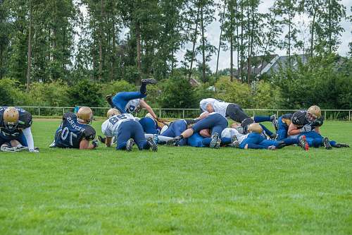 grass men playing football plant