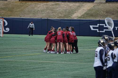 human people having huddle in field during daytime clothing