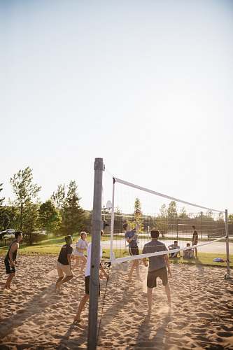 human people playing volleyball people