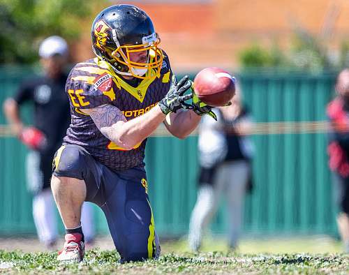 human selective focus photography of football player people