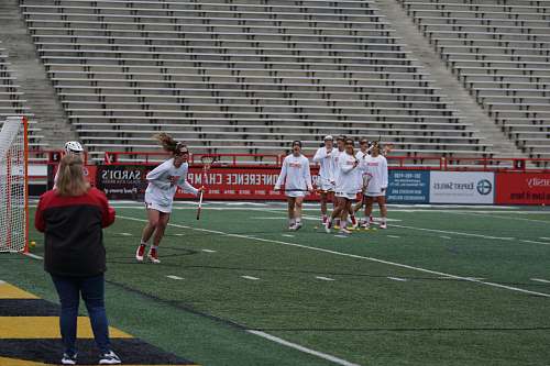 human team roster playing lacrosse on field apparel