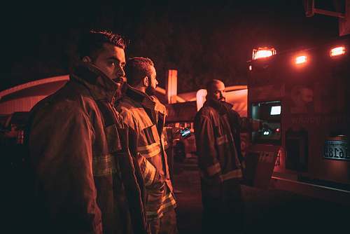 human three fire fighters looking back people