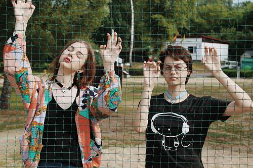 human two women facing net clothing