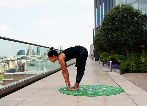 human woman doing yoga touch her feet people