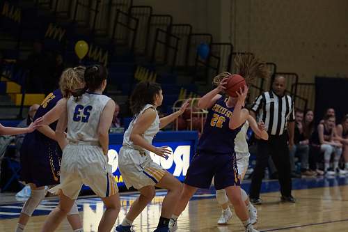 human women playing basketball sphere