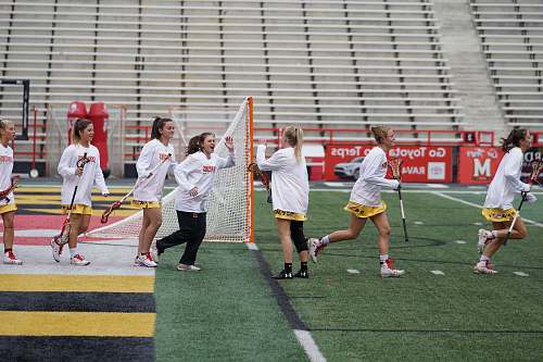 human women walking on field people