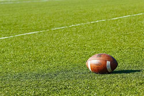grass football on green field during daytime field