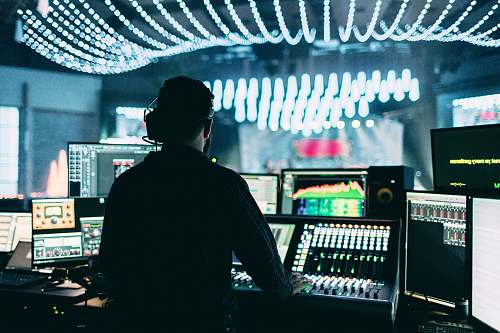 wallpaper silhouette of man using audio mixer production