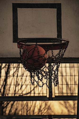 hoop red Spalding basketball ball inside basketball hoop sport