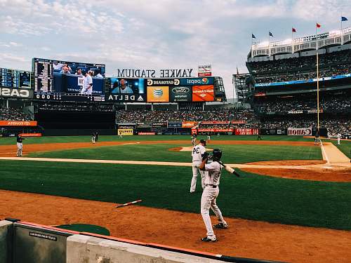 sports baseball players playing on field during daytime baseball